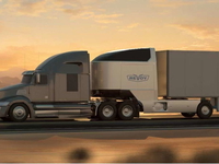 A big rig using a high-tech electric dolly with its own motor and a battery pack.