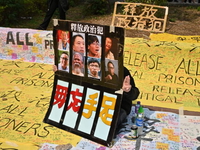 A supporter displays a placard outside the West Kowloon court in Hong Kong on March 1, 202