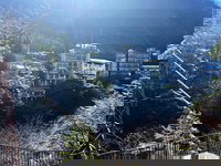 An explorer found a hauntingly preserved resort town in Japan, where towering hotels sit crumbling along a riverside cliff. It's reportedly been untouched for over three decades.