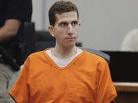 Bryan Kohberger sitting down in court. He's wearing an orange jumpsuit.