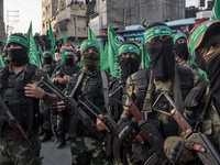 Hamas terrorists marching in Gaza during a parade.