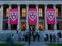 Harvard University banners hang in May 2025