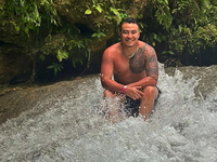 Kevin Mares poses for a picture while in water