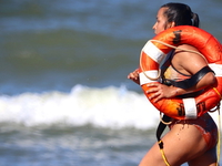lifeguard running at beach