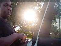Marianne Isnar talks to a police officer.