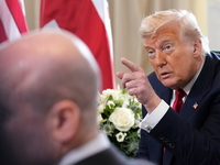 President Donald Trump speaks with the media