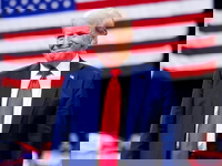 Trump in front of flag