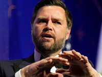 Vance gestures with hands during DC gala